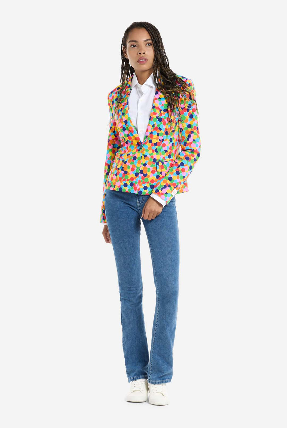 Woman wearing womens blazer with confetti print, holding bottom of the blazer with two hands