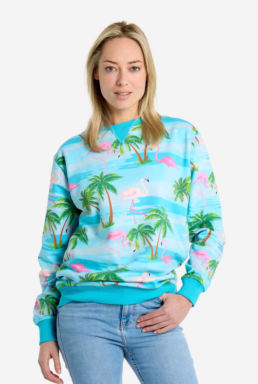 Man wearing blue sweater with tropical flamingo print