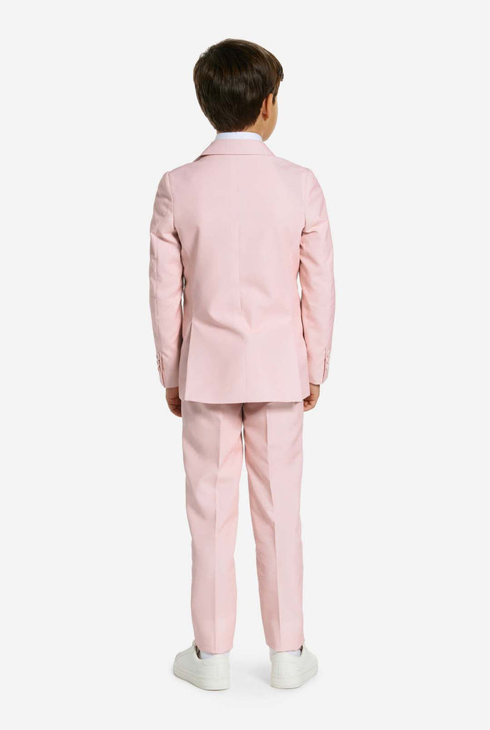 Kid wearing soft pink boys suit, view from the back