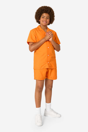 Person wearing an orange shirt and shorts summer set on a white background. Full body image.
