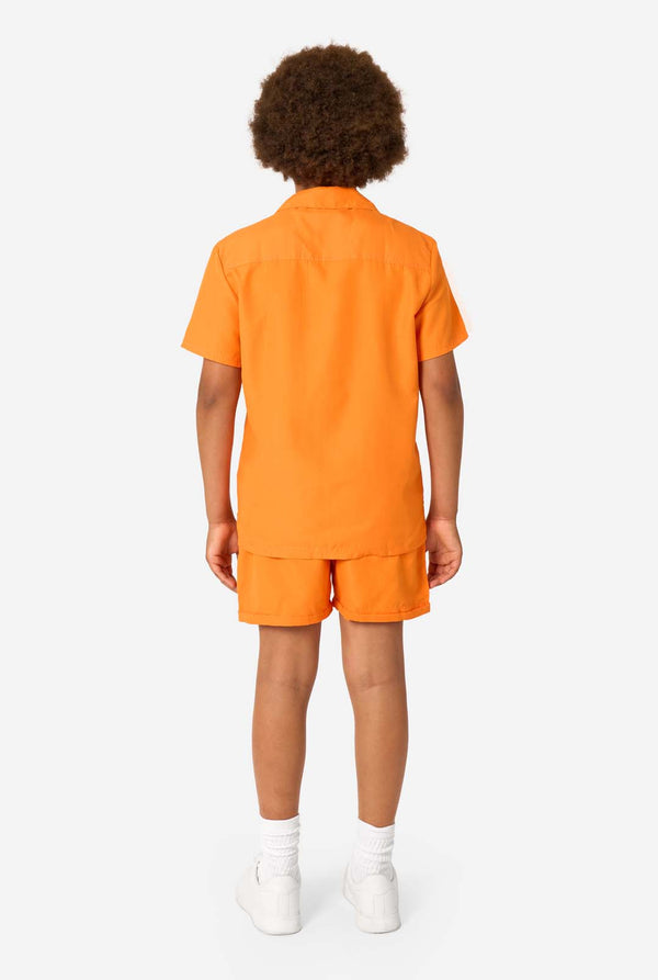 Person wearing an orange shirt and shorts summer set on a white background. View from the back.