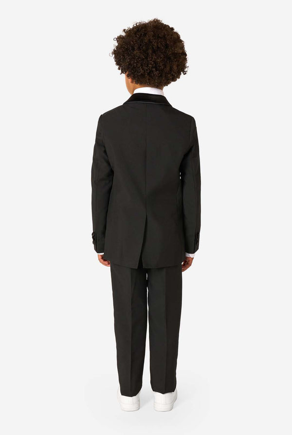 Person wearing a black suit on a white background. View from the back.