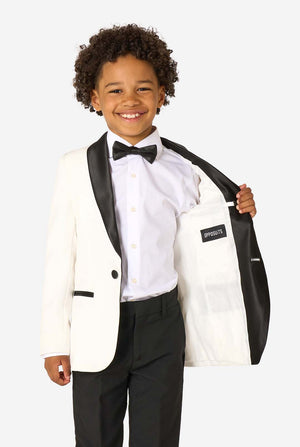 Child wearing a formal tuxedo with a white jacket, black pants, and bow tie on a white background.