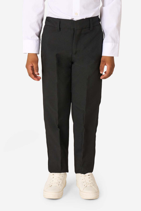 Person wearing black pants and white shoes on a white background