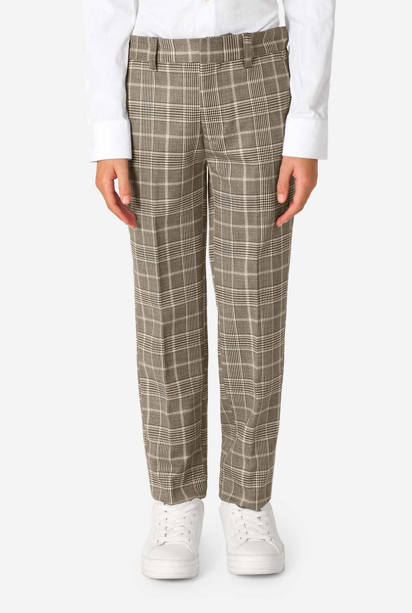 A boy wearing a tan checkered suit with a white dress shirt. The suit has a modern fit with two buttons and flap pockets. He stands against a plain white background. Close up of the pants