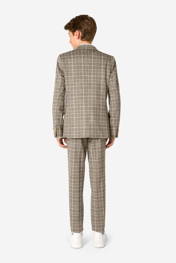 A teen boy wearing a tan checkered suit with a white dress shirt. The suit has a modern fit with two buttons and flap pockets. He stands against a plain white background. View from the back
