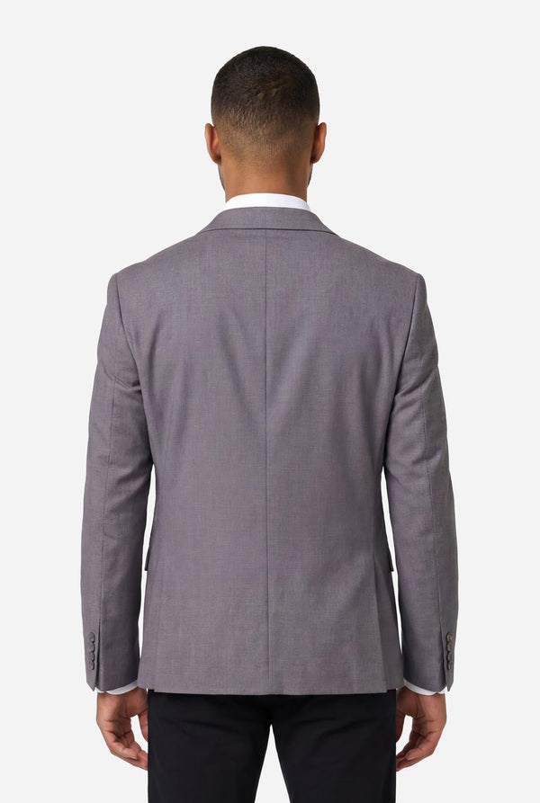 Image of a man wearing a grey blazer from OppoSuits Daily. also wearing a white shirt and black pants. View from the back.