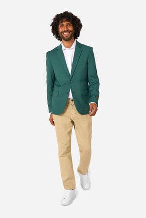 Man wearing a green blazer, white shirt, beige pants, and white shoes on a white background