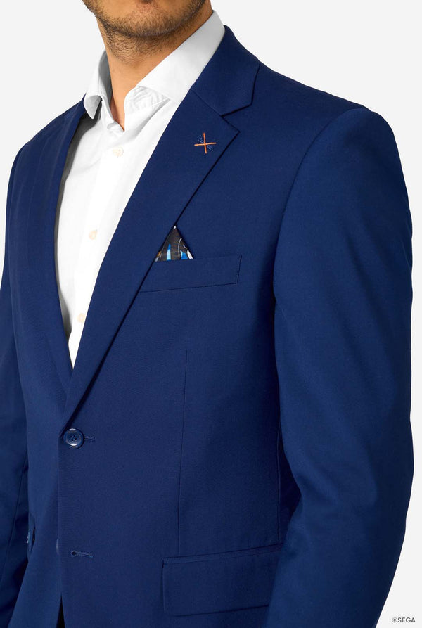 Close-up of a blue blazer’s upper section with an orange stitch detail and a blue patterned pocket square