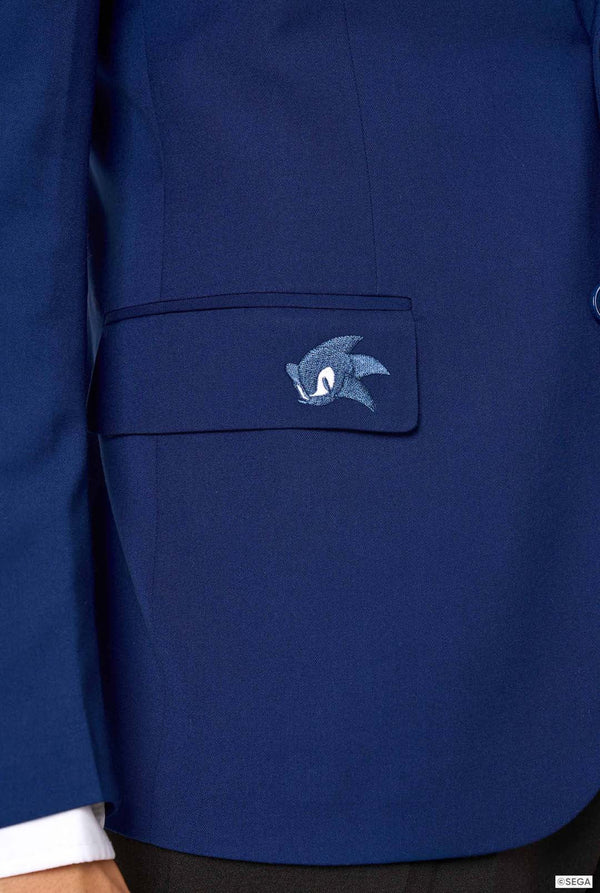 Close-up of a blazer pocket embroidered with a small Sonic the Hedgehog logo.