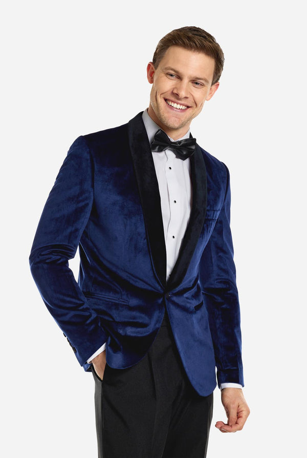 Blue velvet dinner jacket worn by man