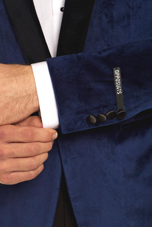 Blue velvet dinner jacket worn by man, close up