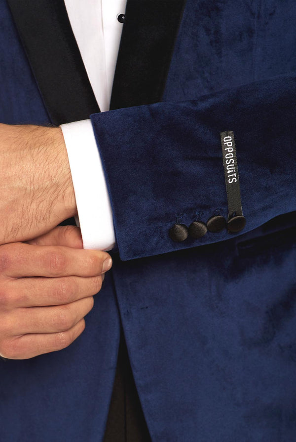 Blue velvet dinner jacket worn by man, close up