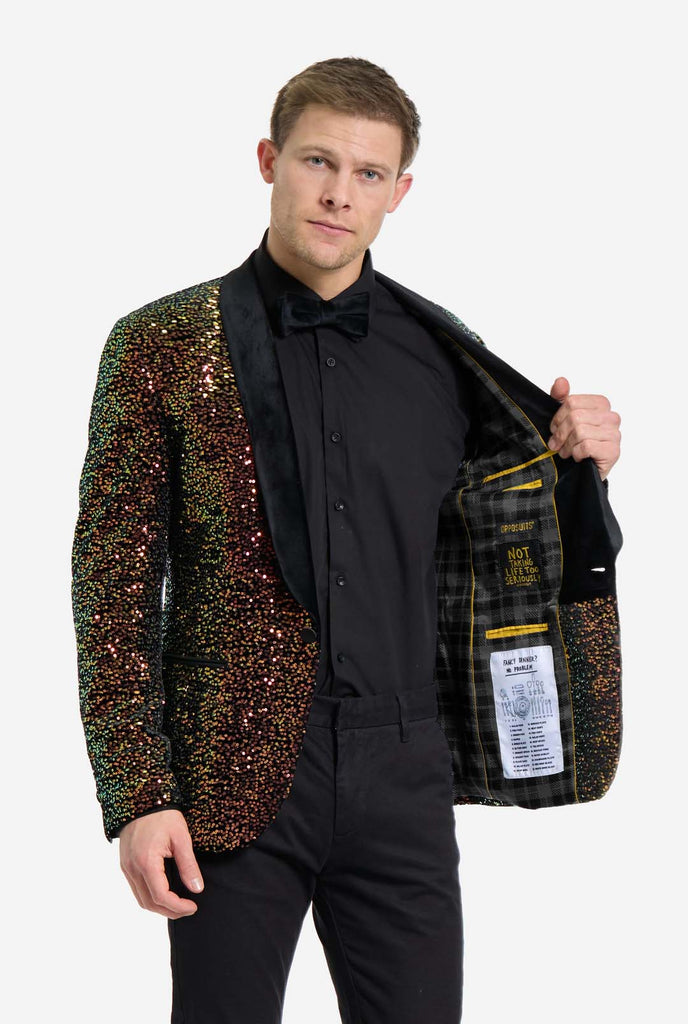 This image showcases a stylish men’s dinner jacket from OppoSuits Deluxe collection, featuring dazzling amber sequins that create a shimmering effect. The blazer has a sleek satin lapel, a tailored fit, and an inner lining with playful details that read, "Not Taking Life Too Seriously." The model pairs it with a classic black dress shirt and bow tie, making this jacket perfect for formal events, holiday parties, or New Year celebrations. Ideal for men who want to stand out with bold and luxurious attire.