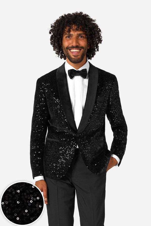 Man wearing a black sequin blazer over a black pants and white shirt on a light background. Including a close-up image in left corner.