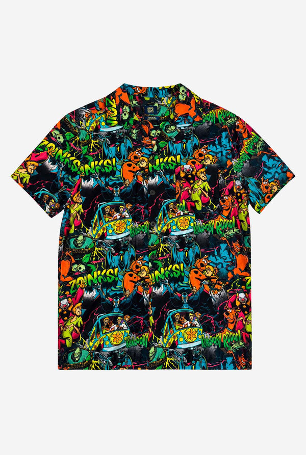 Packshot of the front side of a short-sleeve Hawaiian shirt with a vibrant, colorful, graphic Scooby-Doo print on a black background, against a plain light gray background.