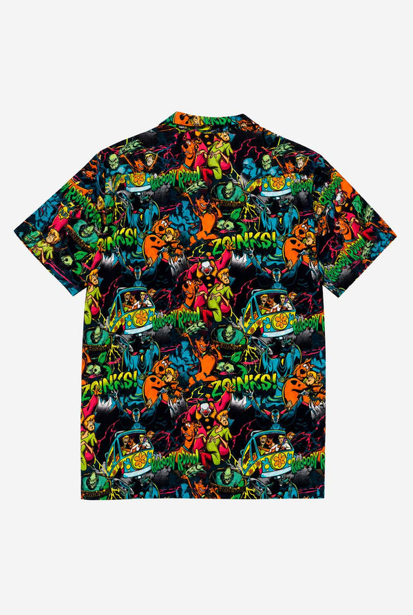 Packshot of the back side of a short-sleeve Hawaiian shirt with a vibrant, colorful, graphic Scooby-Doo print on a black background, against a plain light gray background.