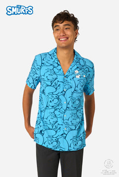 Person wearing a blue 'The Smurfs' themed shirt on a white background
