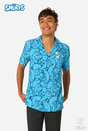 Person wearing a blue 'The Smurfs' themed shirt on a white background