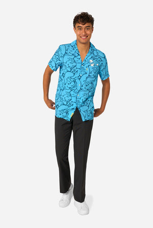 Person wearing a blue 'The Smurfs' themed shirt on a light background. Full body image.