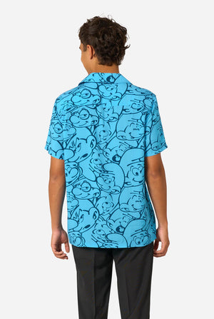Person wearing a blue 'The Smurfs' themed shirt on a light background. View from the back.