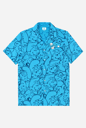 Blue shirt with cartoon character pattern on a white background. Front view