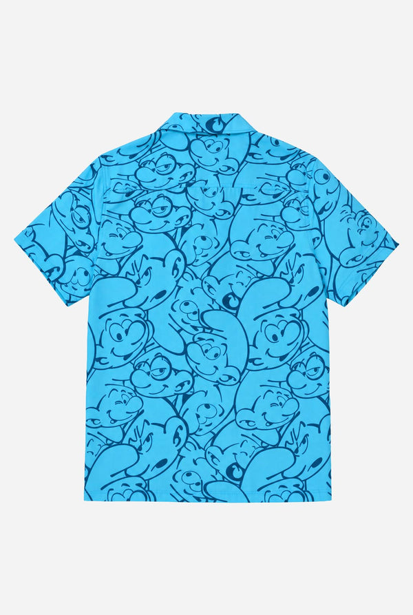 Blue shirt with Smurfs character pattern on a white background. Back view.