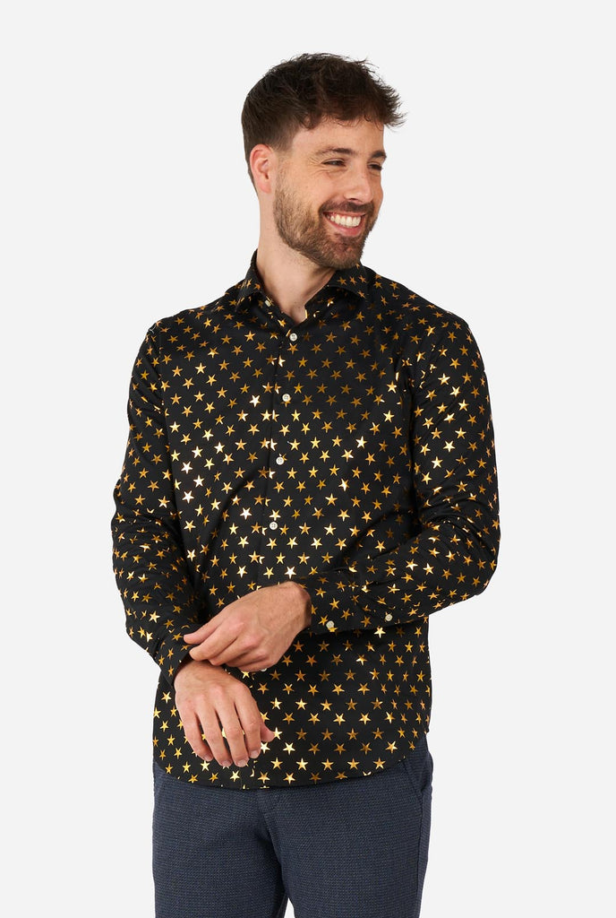 This image showcases a stylish men's dress shirt from OppoSuits, designed with a black base adorned with an eye-catching gold star pattern. The shirt has a sleek and contemporary fit, perfect for those who want to add a touch of flair to their wardrobe. Ideal for festive occasions, parties, or making a bold statement, this shirt combines elegance with a unique, playful twist. 