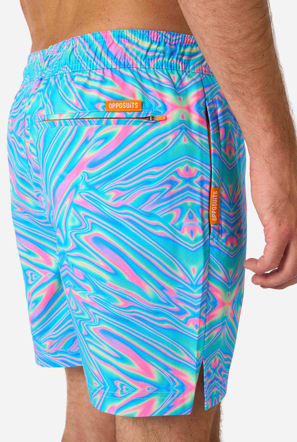 Man wearing a men's vibrant holographic swim shorts with a mesmerizing blue, pink, and purple swirl design. Eye-catching and stylish swimwear for summer fun. Close up side.