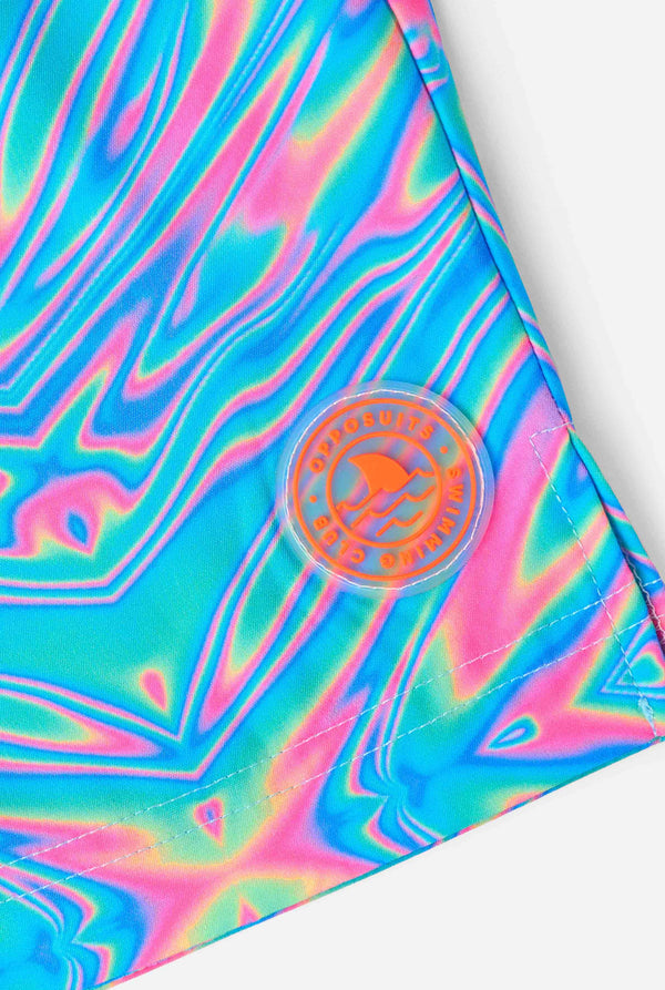 Man wearing a men's vibrant holographic swim shorts with a mesmerizing blue, pink, and purple swirl design. Eye-catching and stylish swimwear for summer fun. Close-up patch.