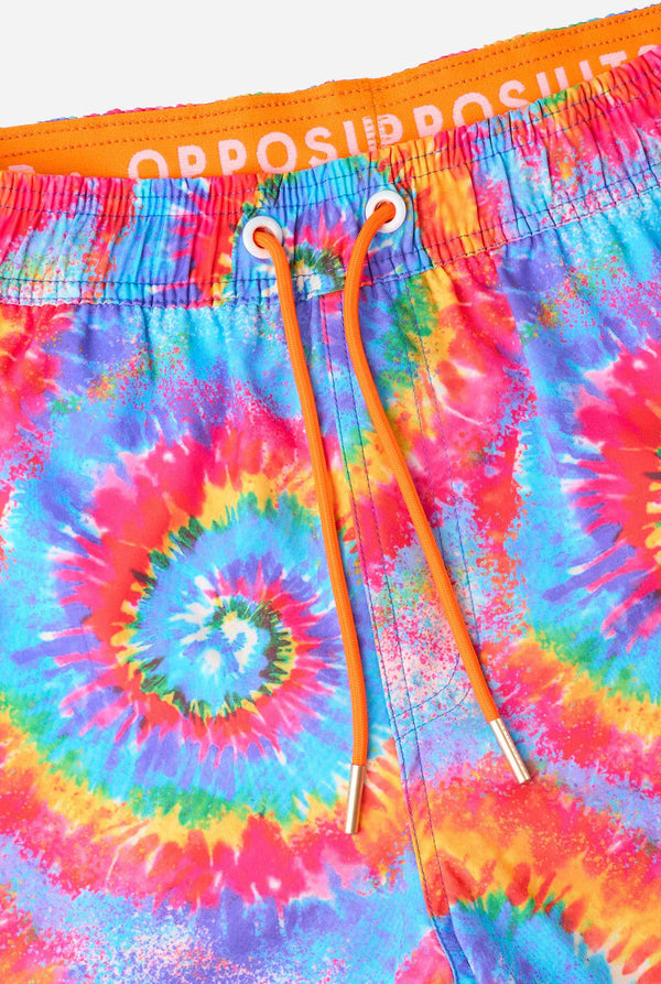 Men's rainbow tie-dye swim shorts with a bold, colorful spiral pattern. A fun and trendy choice for beach days and pool parties. Close-up drawstring.