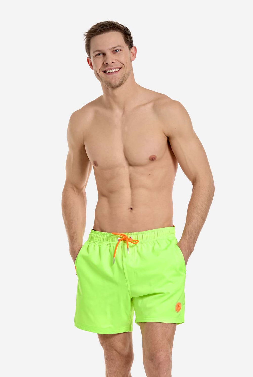 Man wearing Neon lime green swim trunks for men, close up
