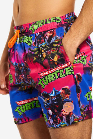 Man wearing TMNT Dude swim trunks for men, close up