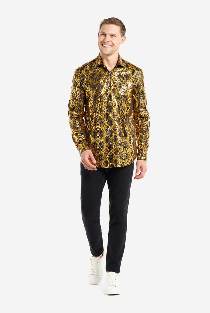 This image showcases a men’s dress shirt from OppoSuits, featuring a striking gold and black snakeskin print pattern. The shirt’s fabric has a glossy finish that reflects light, creating a bold, high-fashion look perfect for making a statement. With a detailed reptile-inspired pattern, this shirt is ideal for anyone looking to bring some edgy style to their wardrobe. Full body image