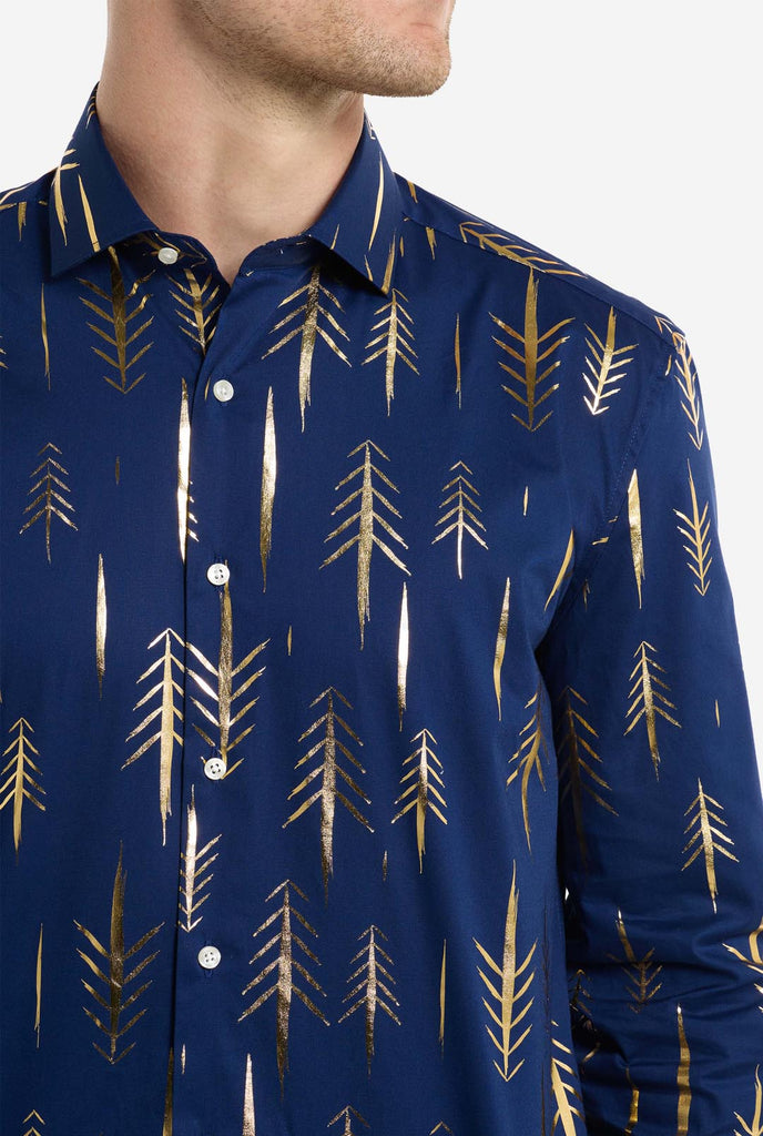 This image features a men’s dress shirt from OppoSuits in a deep navy blue color with an elegant, metallic gold tree pattern. The shirt has a modern slim fit, perfect for adding a festive or stylish touch to any wardrobe. The metallic gold details catch the light, giving it a striking look that's ideal for holiday parties, night outs, or unique gatherings. A perfect shirt for anyone looking to make a fashionable statement with a touch of seasonal flair. Chest close-up.