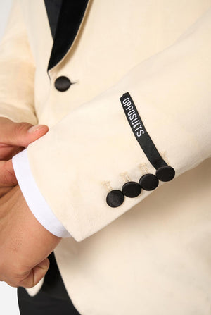Close-up of a beige blazer with black buttons and 'OPPOSUITS' branding.