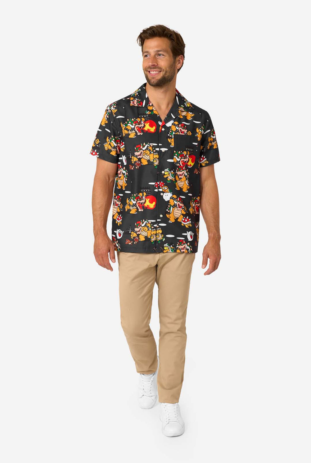 Man wearing short-sleeve black Bowser’s Mayhem shirt with colorful Bowser print.