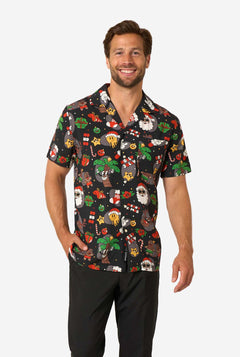 Man wearing a colorful patterned shirt on a white background
