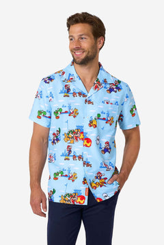Man wearing a colorful shirt with Mario character print on a white background