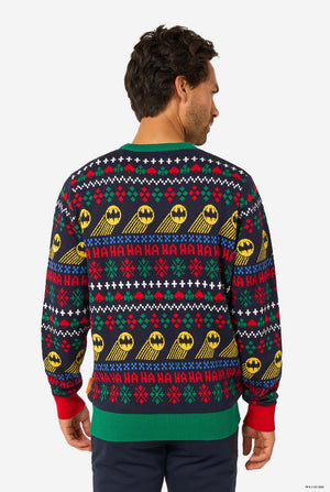 Back view of the knitted Christmas sweater with repeated Batman symbols and festive “Ha Ha Ha” patterns.