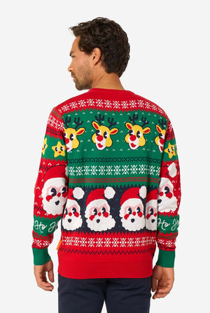 Back view of a knitted Christmas sweater showing repeating Santa Claus and reindeer patterns in festive colors.