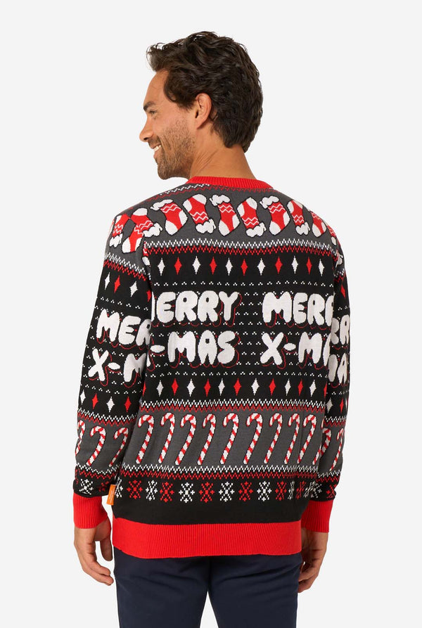 Back view of the knitted Christmas sweater with “Merry X-Mas” text, candy canes, and red Christmas stockings.