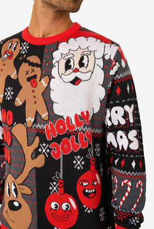Close-up of the knitted Christmas sweater showing Santa, gingerbread men, reindeer, and red ornaments with “Holly Jolly” text.