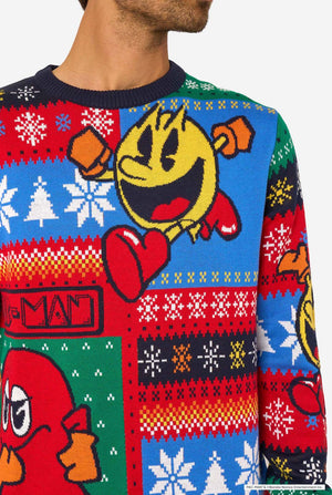 Close-up of the knitted Christmas sweater showing Pac-Man and a red ghost character surrounded by snowflakes.