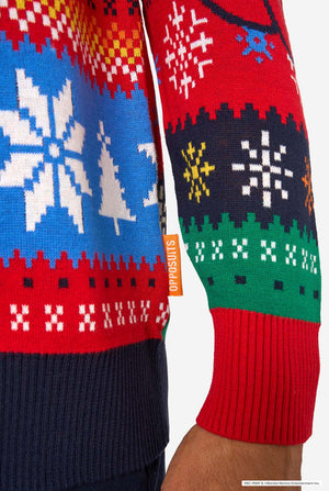 Detail of the knitted Christmas sweater hem with multicolored festive patterns and an orange “Opposuits” label.