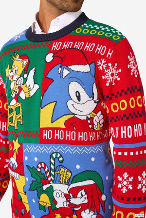 Close-up of the knitted Christmas sweater showing Sonic, Tails, and Knuckles in Christmas designs with “Ho Ho Ho” text.