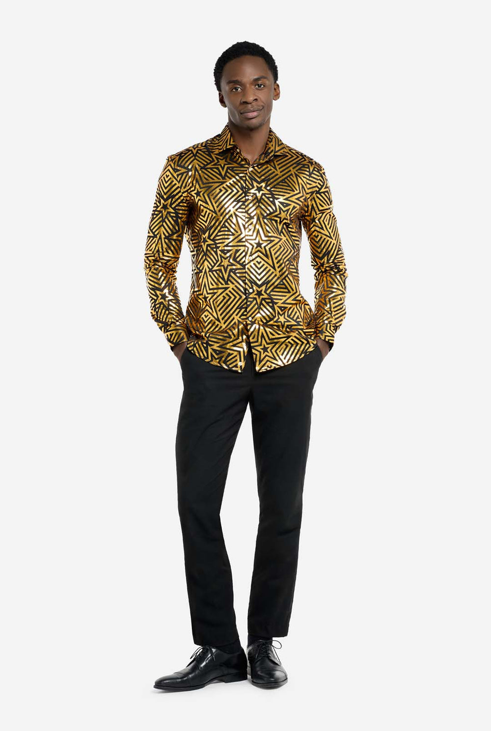 This image features a men’s shirt from OppoSuits with a vibrant gold and black geometric star print pattern. The shirt has a reflective finish that highlights the intricate star and line designs, creating a dynamic and stylish look. Perfect for those who want to stand out, this shirt is both bold and fashionable, ideal for parties, holiday celebrations, or nightlife. The model wears it paired with black pants.
