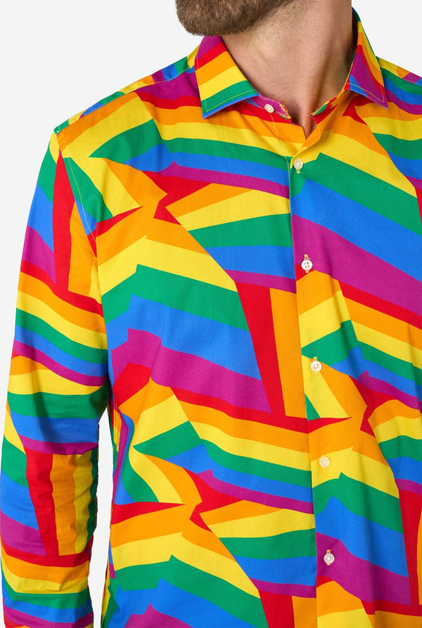 Man wearing a Rainbow colored geometric-patterned shirt on a white background, chest close-up.
