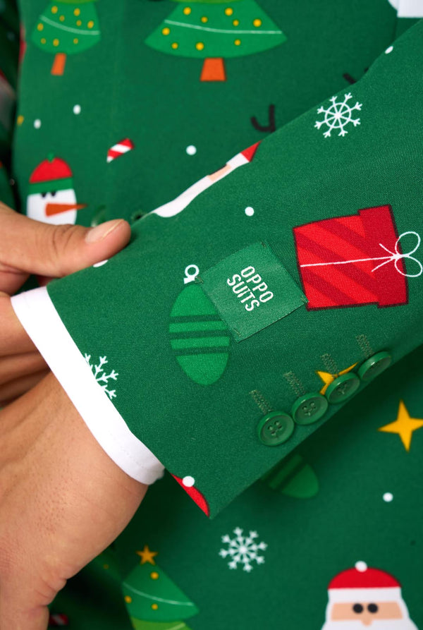 Man wearing green Christmas suits for men with Christmas icons. Sleeve close up.