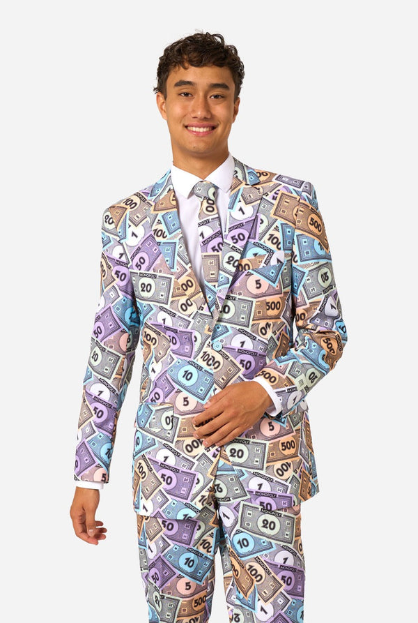Image of a man wearing a men's suit with an all over print from Monopoly money. He is also wearing a white men's shirt.